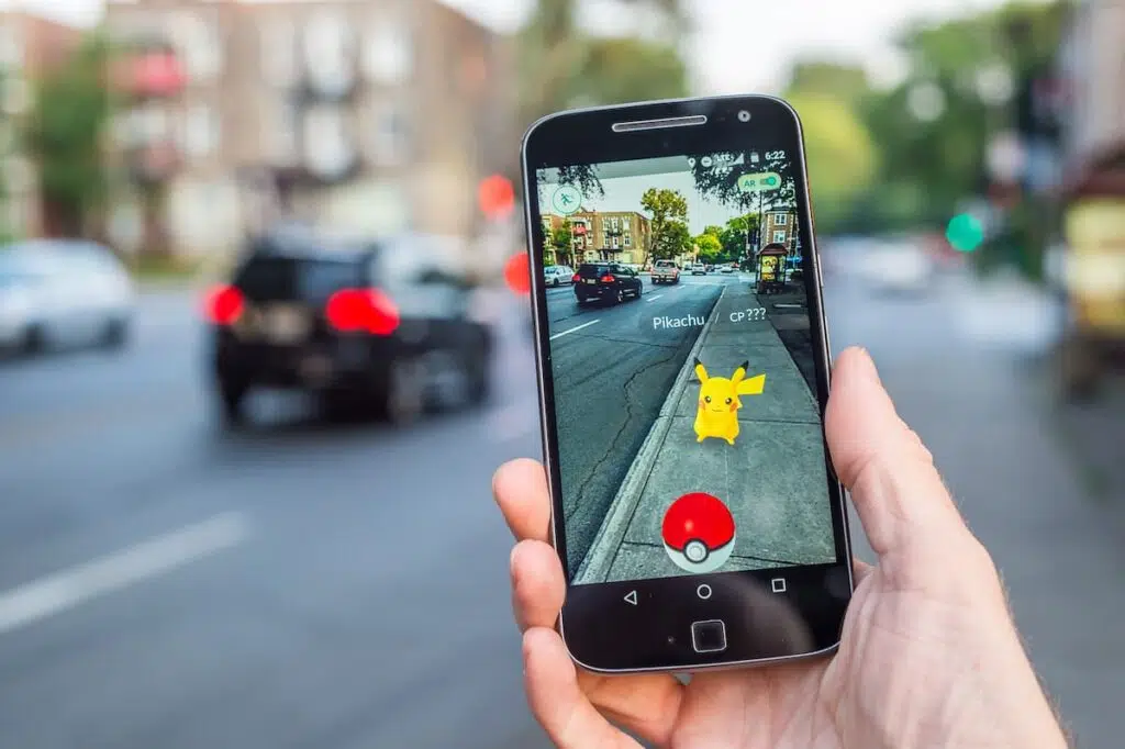 Pokémon GO augmented reality gameplay on smartphone in city environment